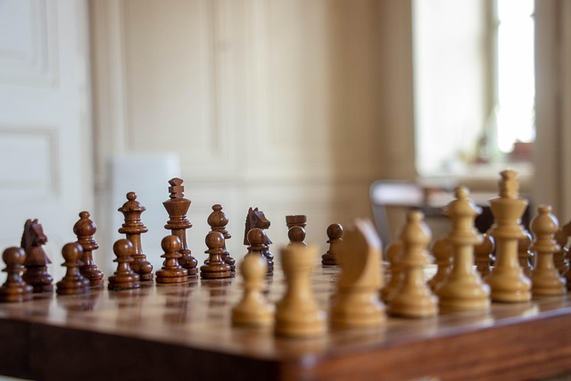 Board game pieces scattered on a table, including cards and dice